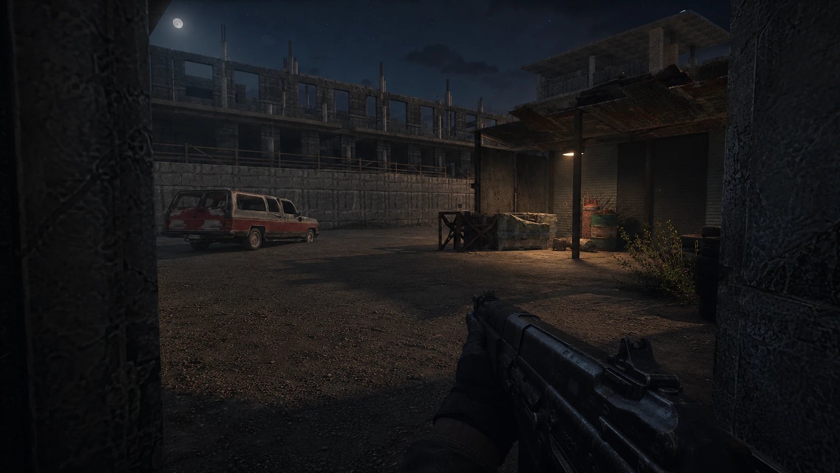 Gameplay: the yard at night under a full moon, rifle raised past a concrete pillar